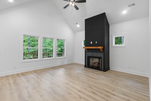 4410 Shiloh Canaan Rd, Palmyra, TN 37142 - unfurnished living room with high vaulted ceiling, ceiling fan, a fireplace, light wood-type flooring, and baseboards