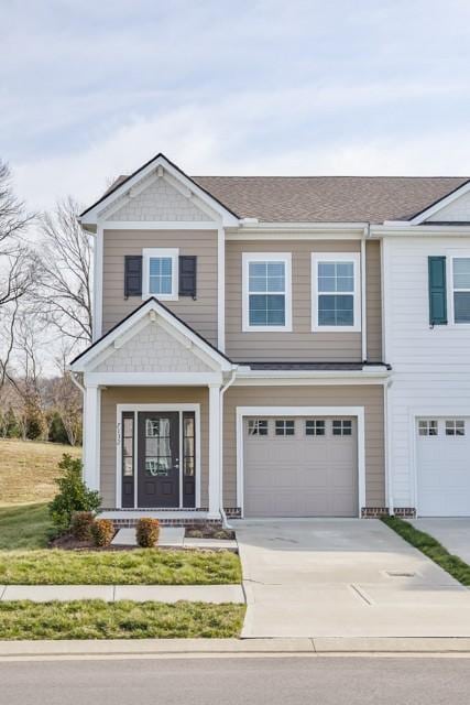 view of front of home with a garage and driveway