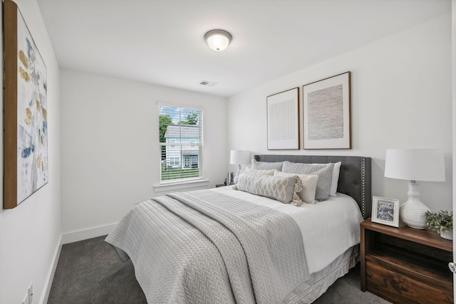 bedroom with carpet, visible vents, and baseboards