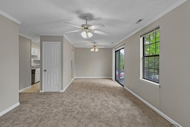 spare room featuring visible vents, light carpet, baseboards, and ornamental molding