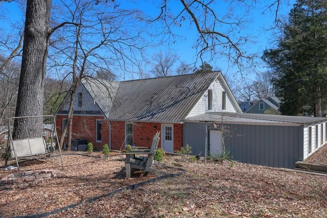 view of front facade with a garage and brick siding