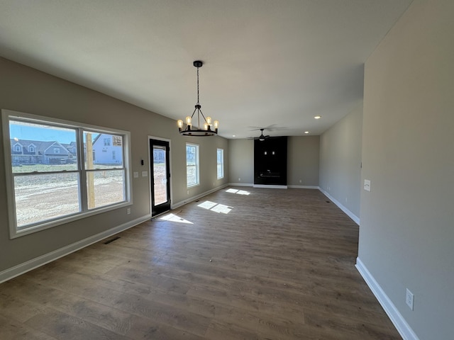 unfurnished dining area with dark wood finished floors, visible vents, recessed lighting, and baseboards