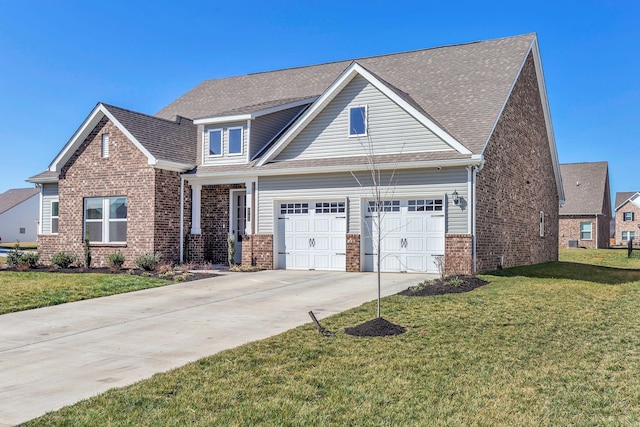 craftsman-style house featuring brick siding, a shingled roof, a front yard, a garage, and driveway