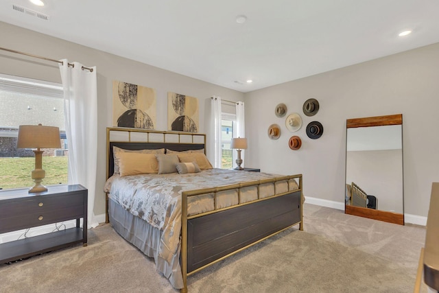 carpeted bedroom featuring visible vents, recessed lighting, and baseboards