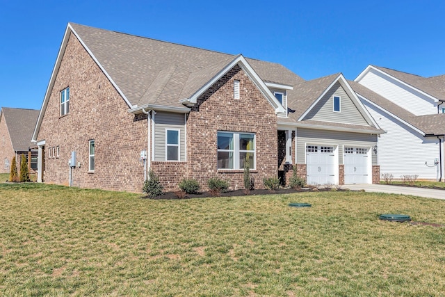 craftsman-style home featuring a shingled roof, concrete driveway, a front lawn, a garage, and brick siding