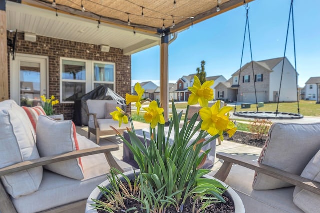 view of patio / terrace featuring a residential view and an outdoor hangout area