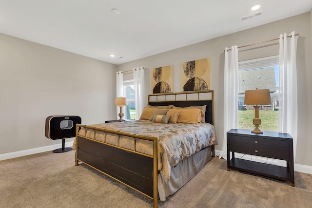 carpeted bedroom with visible vents, recessed lighting, and baseboards