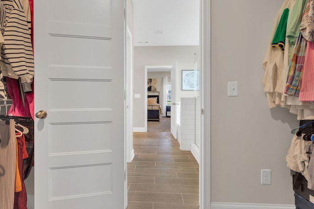 interior space with wood finish floors and baseboards