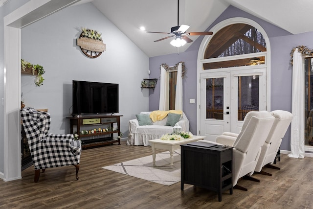 living area with a ceiling fan, vaulted ceiling, and wood finished floors