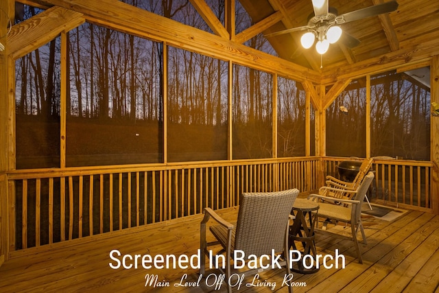 sunroom featuring wood ceiling, vaulted ceiling with beams, and a ceiling fan