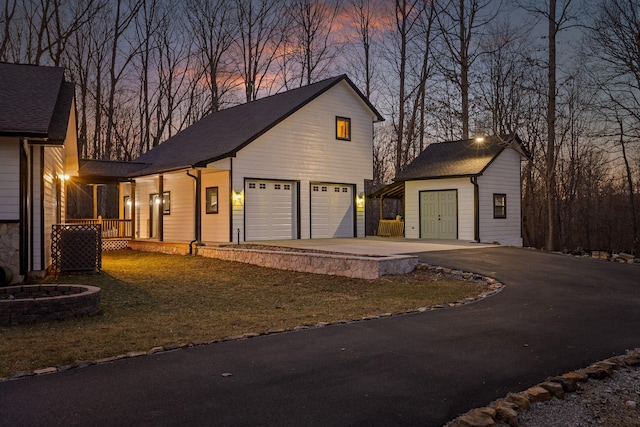 exterior space with a porch and driveway