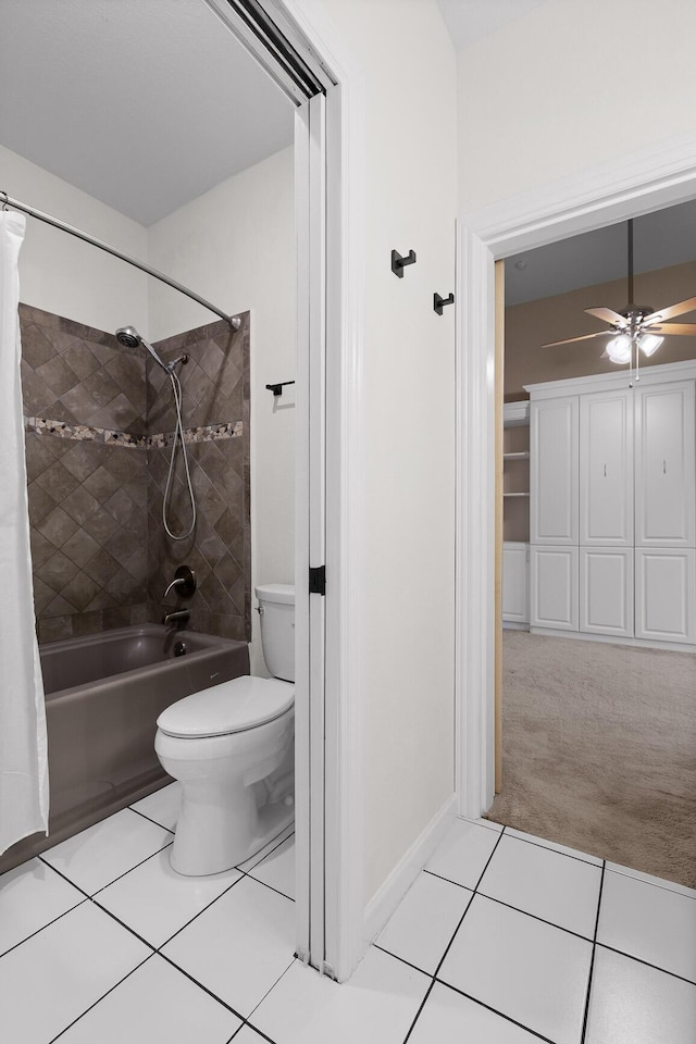 bathroom with tile patterned flooring, toilet, shower / bathtub combination with curtain, and a ceiling fan