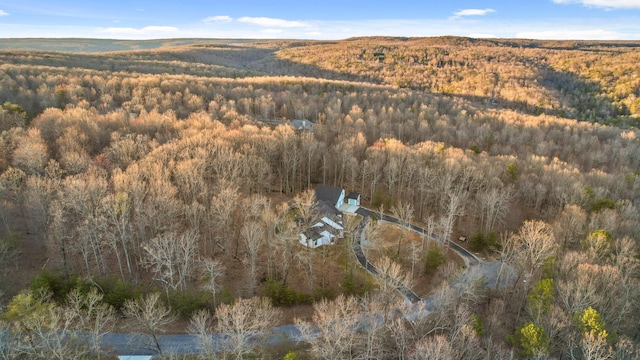 birds eye view of property with a forest view