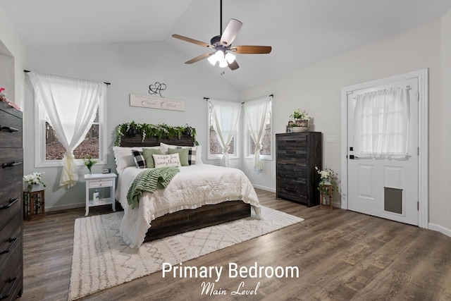 bedroom with a ceiling fan, lofted ceiling, wood finished floors, and baseboards