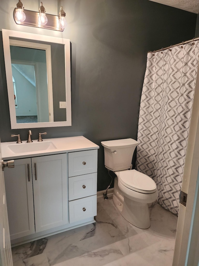 full bathroom featuring toilet, marble finish floor, a shower with shower curtain, baseboards, and vanity