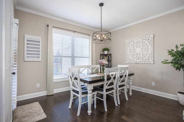 dining area featuring dark wood finished floors, a notable chandelier, crown molding, and baseboards