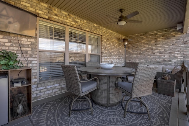 deck featuring outdoor dining area and ceiling fan