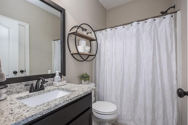 bathroom with a shower with curtain, toilet, and vanity