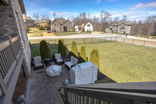 view of yard with a patio area, a residential view, and a fenced backyard