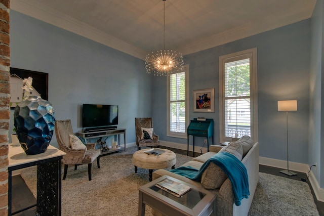 living room with a notable chandelier, a healthy amount of sunlight, and ornamental molding