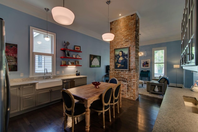 dining space with crown molding and dark wood-style flooring