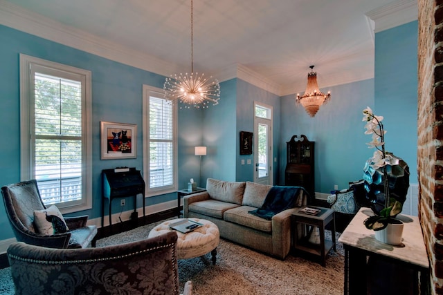 living area with an inviting chandelier, ornamental molding, and a healthy amount of sunlight