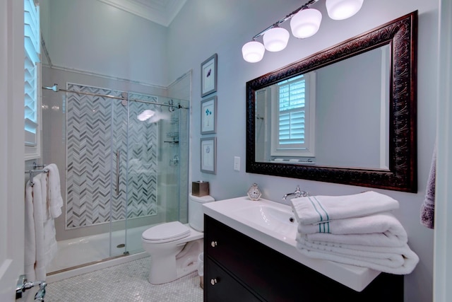 full bath featuring toilet, ornamental molding, a stall shower, tile patterned floors, and vanity