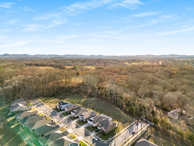 bird's eye view featuring a view of trees and a mountain view