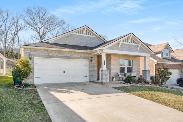 craftsman inspired home with brick siding, a front yard, covered porch, driveway, and an attached garage