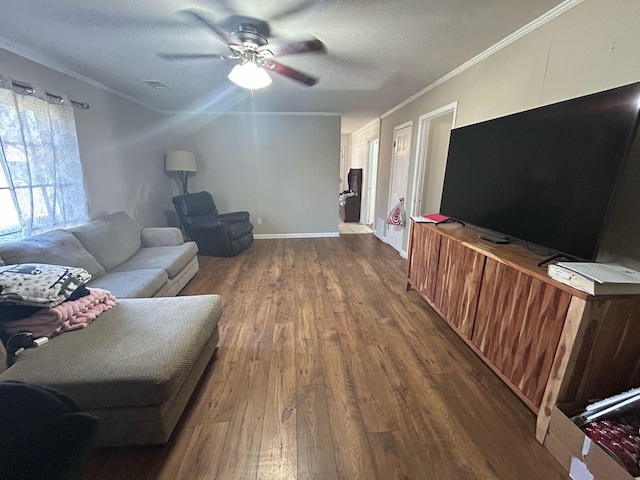 living area with ceiling fan, baseboards, dark wood-style floors, and crown molding