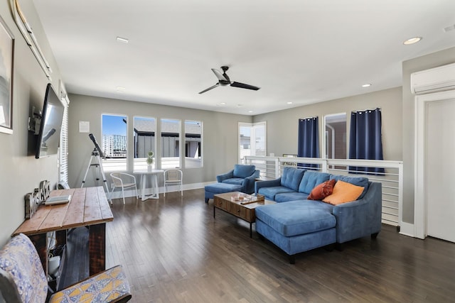 living room featuring dark wood-style floors, recessed lighting, baseboards, and a wall unit AC