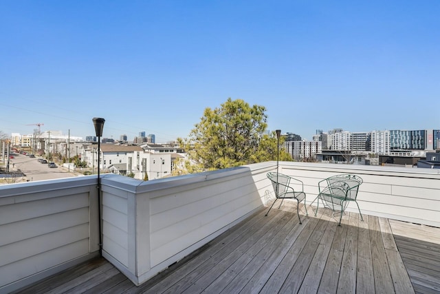 wooden deck with a view of city