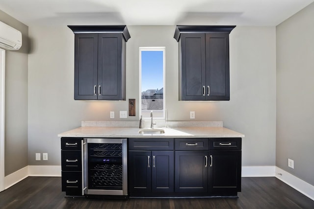 bar with a sink, baseboards, wine cooler, a wall mounted AC, and dark wood-style flooring