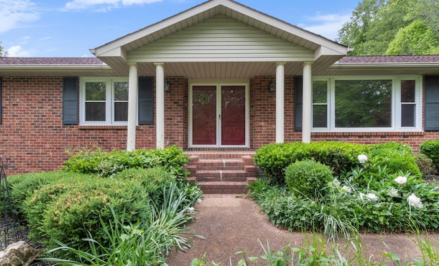 entrance to property with brick siding