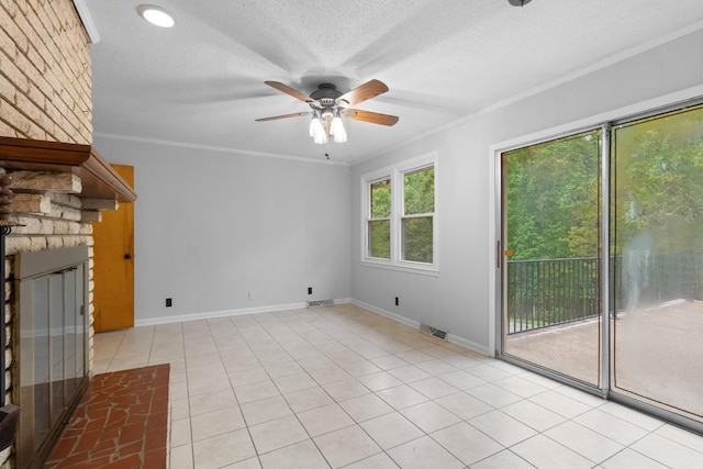 unfurnished living room featuring a textured ceiling, a fireplace, visible vents, and ornamental molding