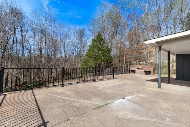 view of patio / terrace featuring fence