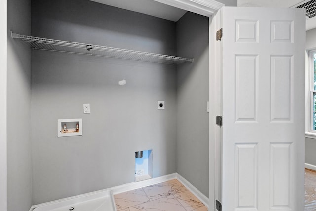 washroom featuring laundry area, marble finish floor, electric dryer hookup, and baseboards