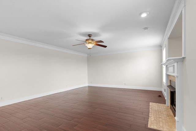 unfurnished living room featuring ornamental molding, a ceiling fan, dark wood-style floors, a fireplace, and baseboards