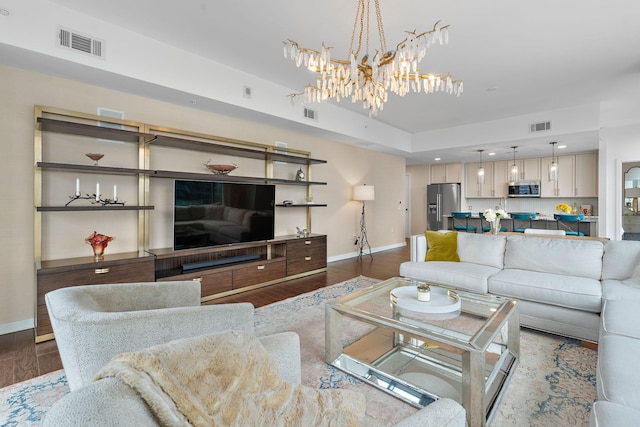 living area featuring dark wood finished floors, baseboards, and visible vents