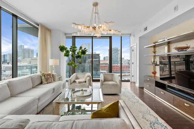 living room with visible vents, a city view, a wall of windows, an inviting chandelier, and dark wood-style floors