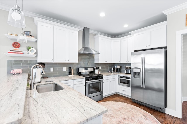 kitchen featuring a sink, crown molding, appliances with stainless steel finishes, wall chimney exhaust hood, and open shelves