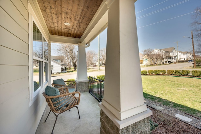 view of patio / terrace with covered porch and a residential view