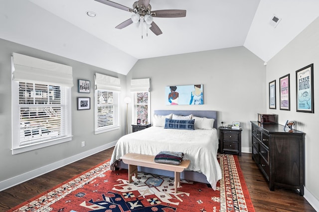 bedroom featuring lofted ceiling, wood finished floors, visible vents, and baseboards