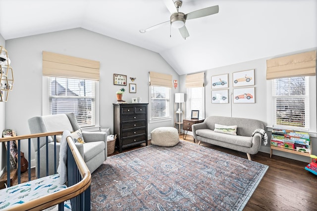 living room featuring a ceiling fan, lofted ceiling, and wood finished floors