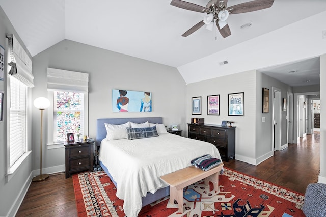 bedroom featuring a ceiling fan, vaulted ceiling, wood finished floors, and baseboards