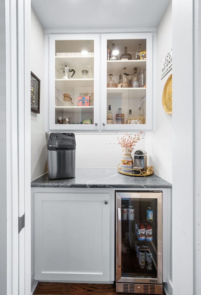 bar with beverage cooler and a dry bar