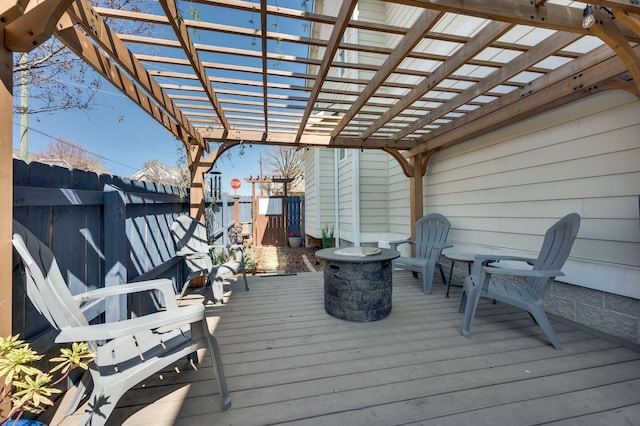 wooden deck featuring a pergola and fence