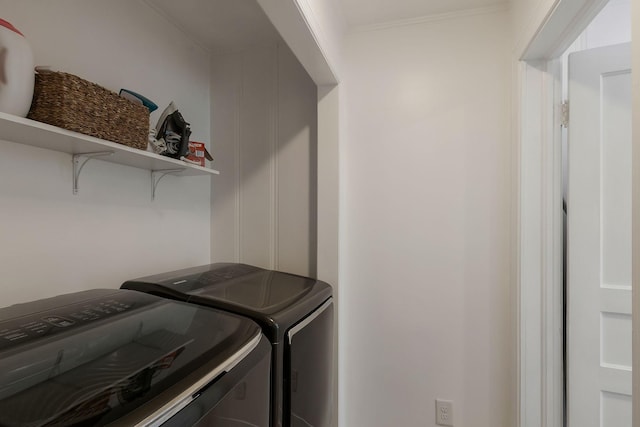 laundry room with washer and dryer and laundry area