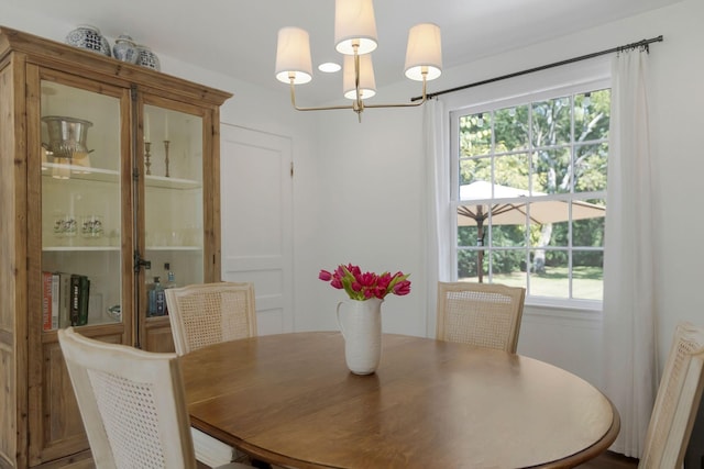 dining space featuring an inviting chandelier