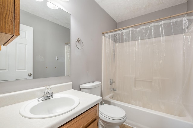 bathroom featuring toilet, a textured ceiling, vanity, and shower / bath combo